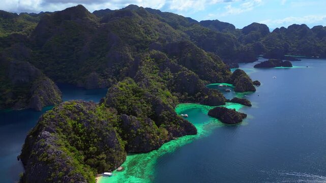 Coron Lagoon with limestone karsts turquoise waters. Nice aerial view drone