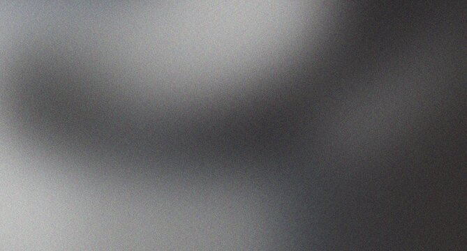 Abstract smooth blurred dark grey gradient background with light blur and grainy noise texture creating a moody and atmospheric visual.