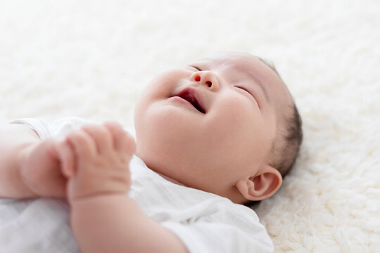 Cute Chinese baby on Bed 