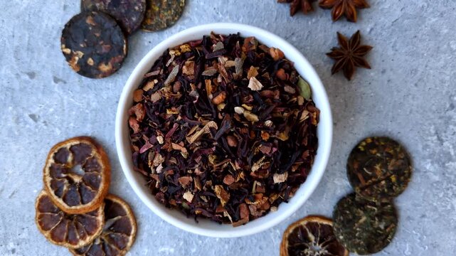 Dry herbal or fruit tea with flower petals and aromatic additives. Dry fruit herbal tea as a background for your design