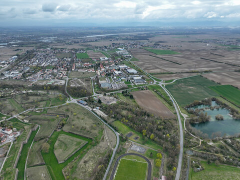 Aerial view of the star-shaped fortress with its intricate bastions contrasting with the sprawling fields, Neuf-Brisach, Grand Est, France.