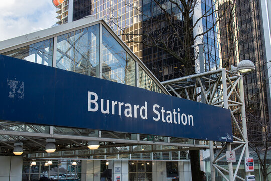 Vancouver, BC, CANADA - Jan 23 2023 : Street-level view of the Burrard Station entrance canopy displaying the TransLink SkyTrain station sign in downtown Vancouver.