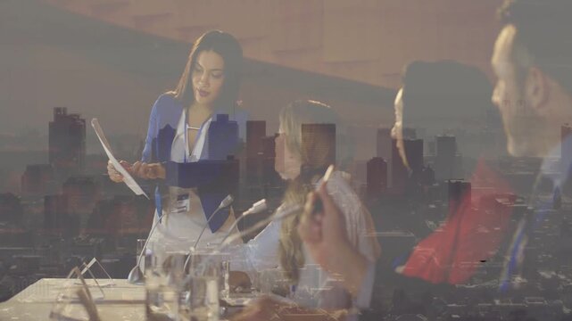 Vertical video: Speaker rising, holding page, reading and pointing, guiding panel under skyline