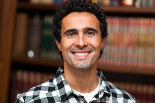 Smiling man in a library