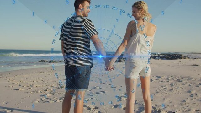Vertical video: Couple walking beach joining hands blue HUD tracking, spinning playfully for tech