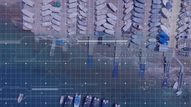 Vertical video: View sliding down, HUD tracking boats as red boat departing and showing marina