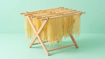 Freshly Made Pasta Drying Rack Pasta Drying Rack Fresh Pasta Cooking Food Preparation Italian Cuisine Noodles. Concept featuring pasta, drying rack, fresh pasta, cooking, food preparation for profe... © Oleksandr