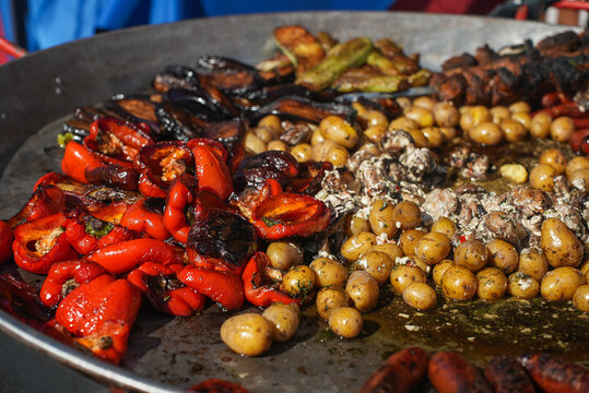 Mediterranean appetizers table concept. Platter with antipasto selection, grilled vegetables, olives, nuts and roasted bread. Overhead view
