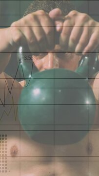 Man tightening grip, lifting green kettlebell while camera rising and charts overlaying for fitness