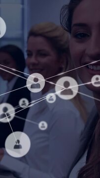 Vertical video: Appearing graphic, woman in blazer turning at meeting, icons sweeping, copy space