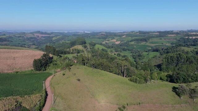 Mixed farmland aerial view with corn, soy fields, native forest and tree plantations.