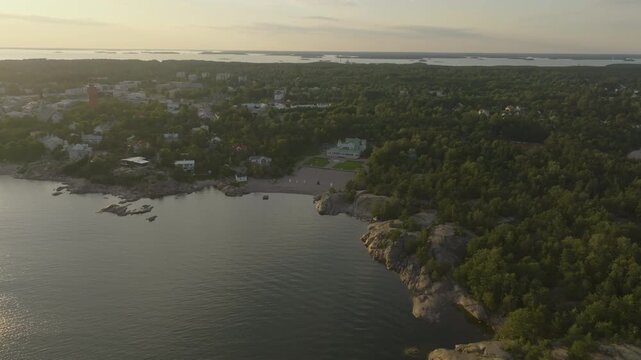 Aerial view approaching the historic Spa park and Casino beach in Hanko, sunset