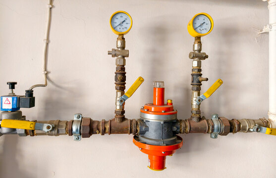 Details of plumbing system showing pressure gauges and control valves in a building