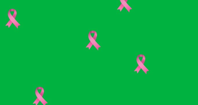 Digital animation of multiple pink ribbon icons falling against black background