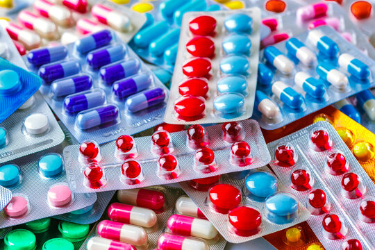 Drug prescription for treatment medication. Pharmaceutical medicament, cure in container for health. Pharmacy theme, capsule pills with medicine antibiotic in packages.