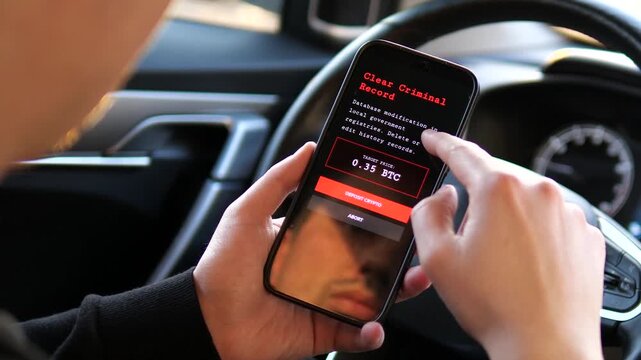 Close-up of a person using an illegal dark web hacker marketplace app on a smartphone. Bypassing firewalls and purchasing criminal record deletion with Bitcoin. Ideal for cybercrime news and security