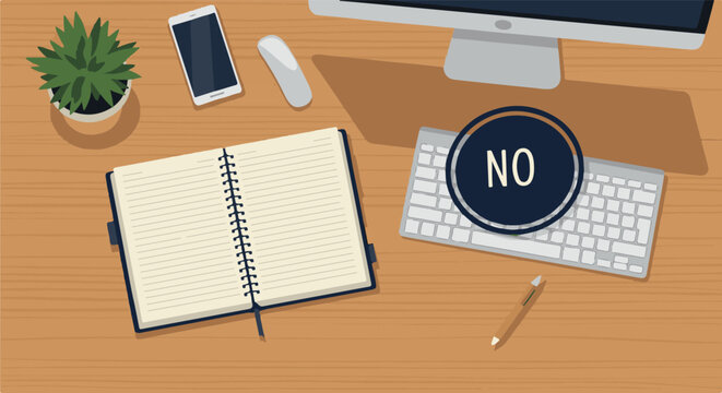 A top-down view of a desk with a computer, keyboard, and notebook