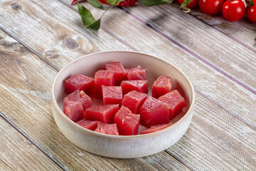 Raw tuna fish cubes heap