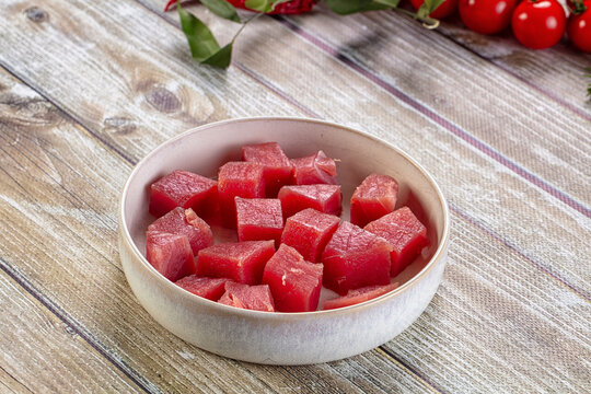 Raw tuna fish cubes heap