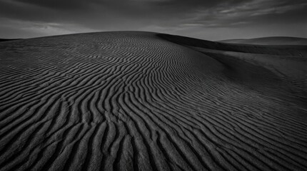 Naklejka premium Dramatic black and white sand dune textures with carved ripples, delicate shadows and refined abstract desert elegance, ultra-realistic, no logos.
