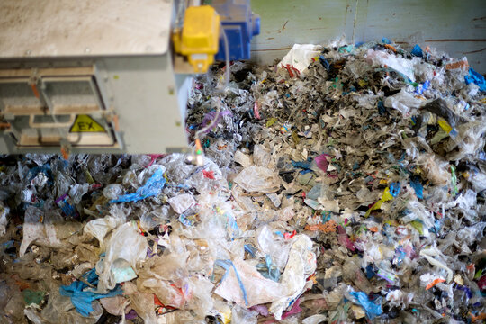 Mixed plastic waste accumulated in an RDF production and waste processing facility. ideal for: recycling, waste to energy, alternative fuel, circular economy and industrial technology themes.