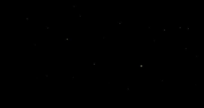 Super slow motion (1000 fps) floating dust particles in the air, isolated on black background. Cinematic atmospheric shot with soft light, depth and abstract texture.