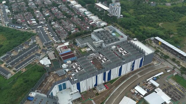 Modern data center complex seen from above, showcasing its large scale architecture and technological infrastructure in an urban asian setting