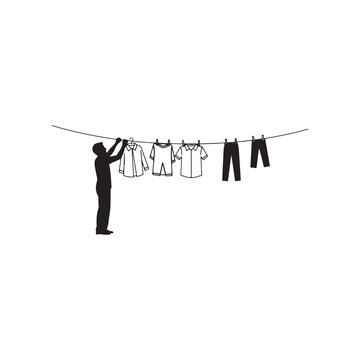 Man hanging clothes on a line silhouette icon vector flat design