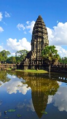 Fototapeta premium Ancient stone temple reflected in calm water