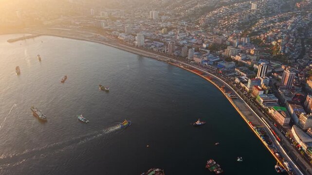 Aerial fly Sunrise at Valparaiso Bay Chile, Beach Cityscape Boats Waterfront Golden Hour