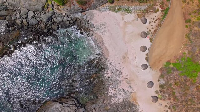 Aerial Tops down coaste of Punta Pite Beach in Valparaiso Chile, travel scenic destination, hidden lagoon