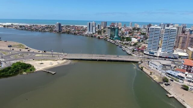 Lateral aerial view of Giuseppe Garibaldi Bridge linking Imbe and Tramandai over the Tramandai River in southern Brazil.
