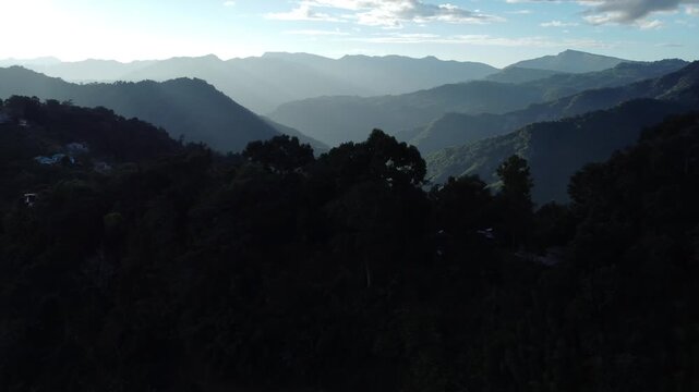 The light of the sunset has created parallel lines on the hills.