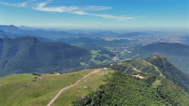 Winding mountain road aerial view along steep forested slopes at Serra da Rocinha in southern Brazil.