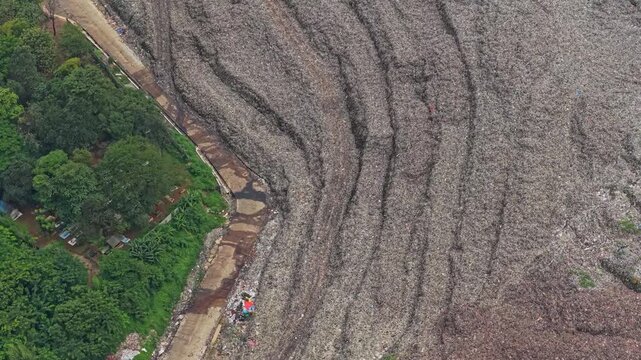 Aerial view of massive landfill mountain in jakarta