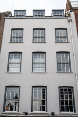 Fototapeta premium British Residential Building Facade With Symmetrical Windows in Classic Style