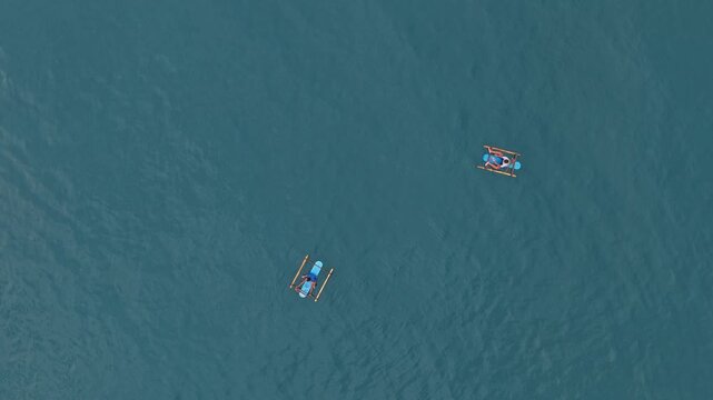 Aerial top down view of traditional indonesian jukung boats in amed bali