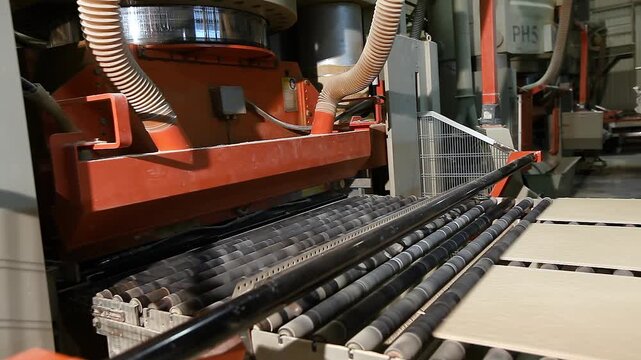 A production or conveyor line at a ceramic and porcelain tile factory. Manufacturing process of ceramic tiles.