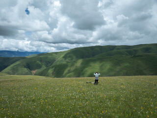 Fototapeta premium Riding bike on grassland mountain top trail