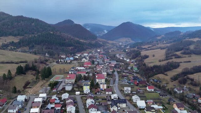 Aerial Drone Flight Over Rural Village in Mountain Landscape