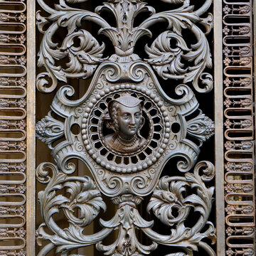 Ornate iron panel with classical face detail