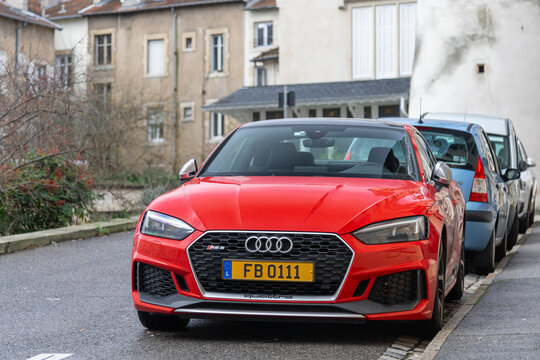 Nancy, France - January 17th 2019 : View on a red Audi RS5 Coup&eacute; finished in Misano Red parked on a street with cars behind and buildings in the background.