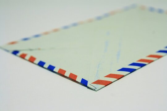 Classic air mail envelope with red and blue striped border