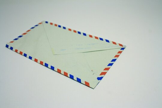 Classic air mail envelope with red and blue striped border