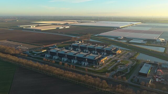Aerial view of a modern data center facility at sunrise