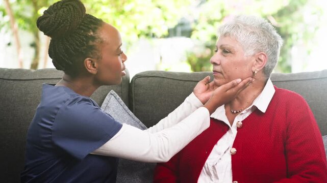 Compassionate Nurse Performs Gentle Health Check-Up for an Elderly Patient in a Comfortable Home Setting