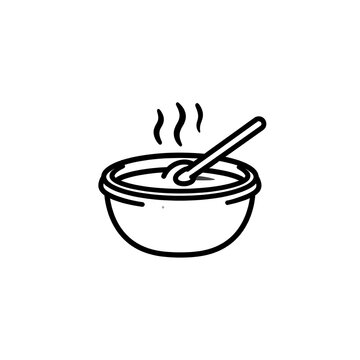 Steaming bowl with spoon inside.