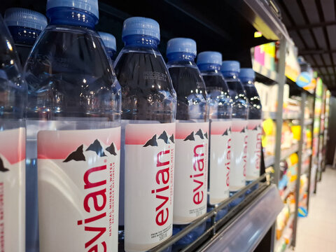 Row of Evian Natural Mineral Water Plastic Bottles Arranged on a Supermarket Retail Shelf in Bangkok Thailand for Sale and Consumer Hydration on January 9, 2026 in Bangkok, Thailand