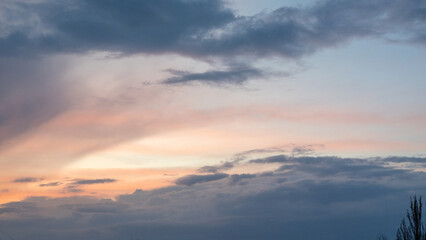 Obraz premium Serene Twilight Sky with Soft Pastel Colors Blending Into Dramatic Clouds, Evoking A Peaceful Evening Ambiance Concept Digital Technology