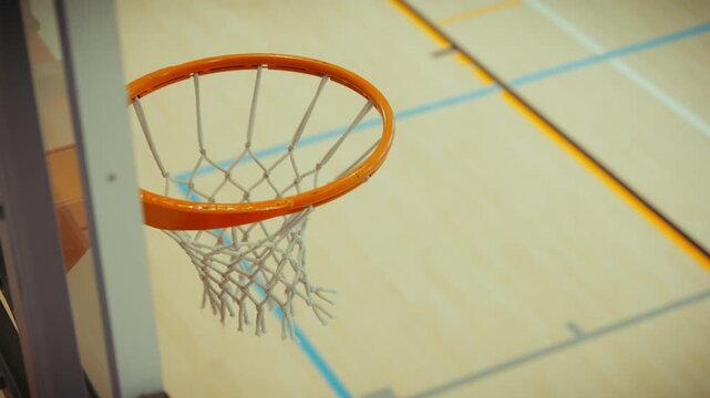 Female athlete scores basketball hoop shot